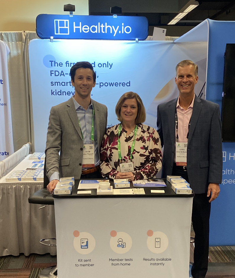 Adam Russell, Paula LeClair, and Chris McMahon at the Healthy.io booth in the exhibit hall